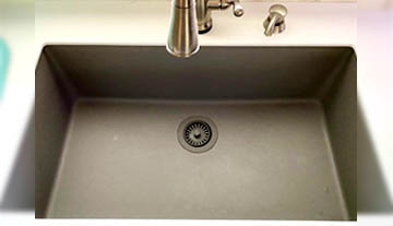 Installed greystone colored Elkay Quartz Classic kitchen sink